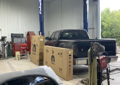 Black truck at repair station
